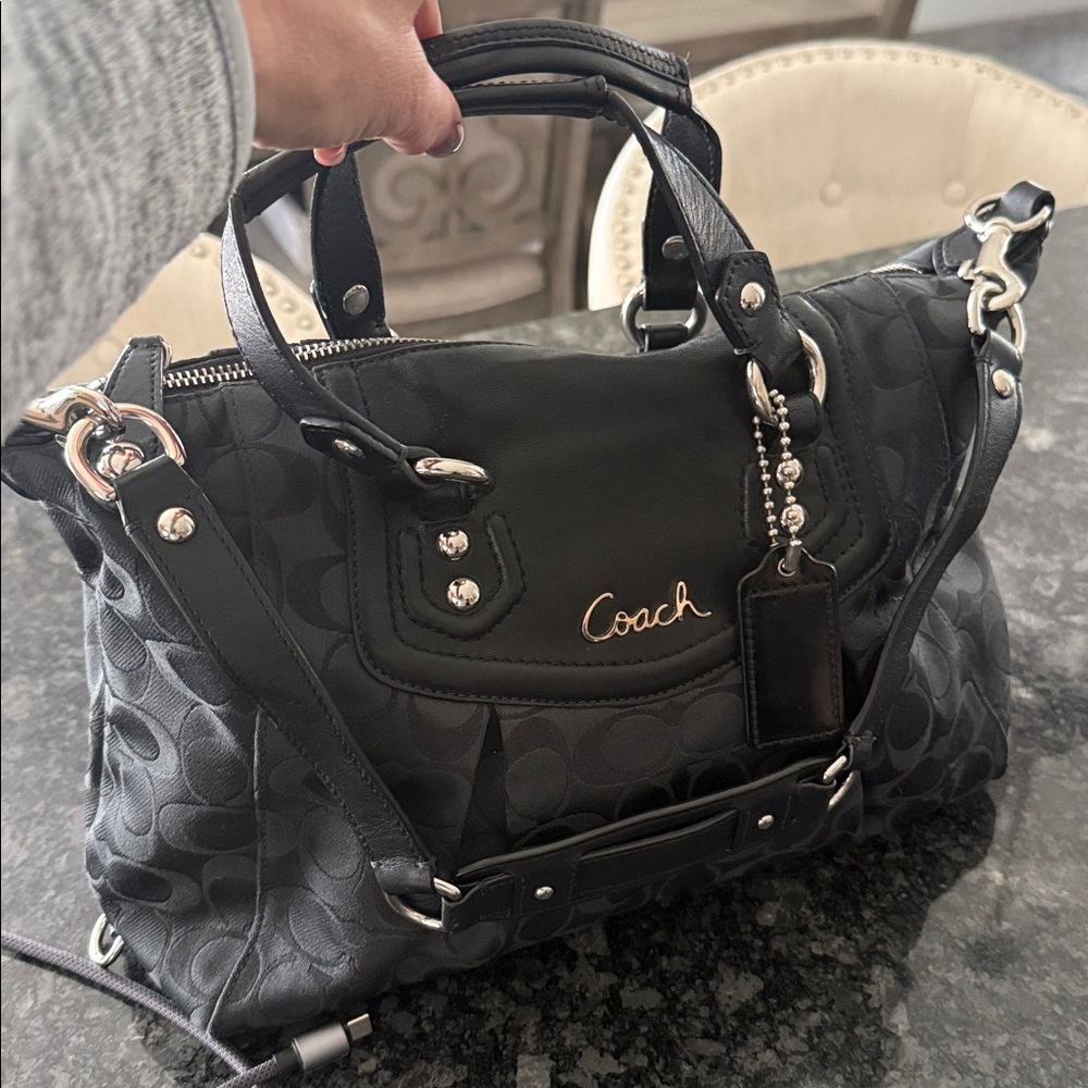 Authentic coach.  Black with signature C pattern.